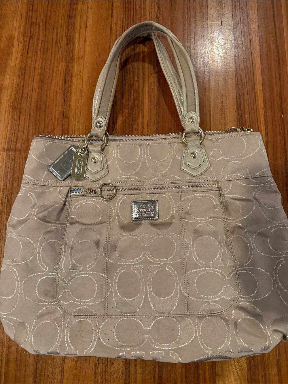 Coach Poppy Signature Lurex Glam Tote bag in a beige and gold colorway